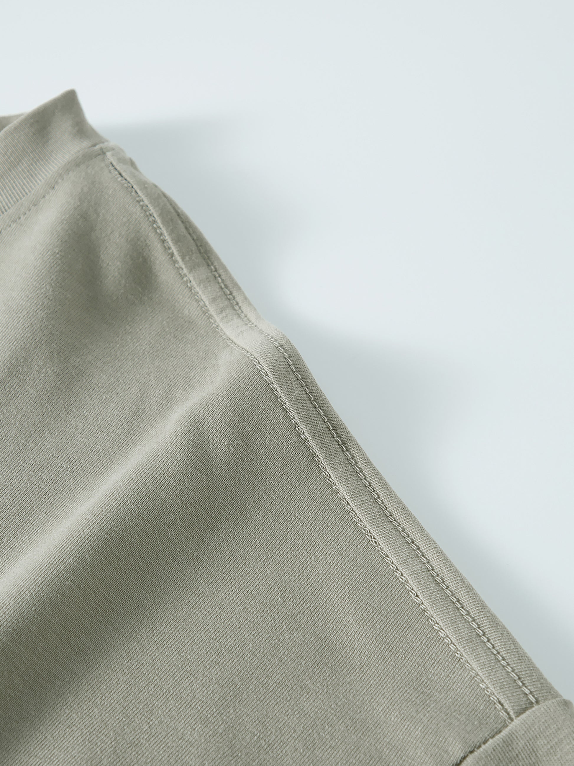 Crossxnails WearGood oversized unisex t-shirt detail, drop shoulder design, premium cotton fabric for Christian streetwear UK.